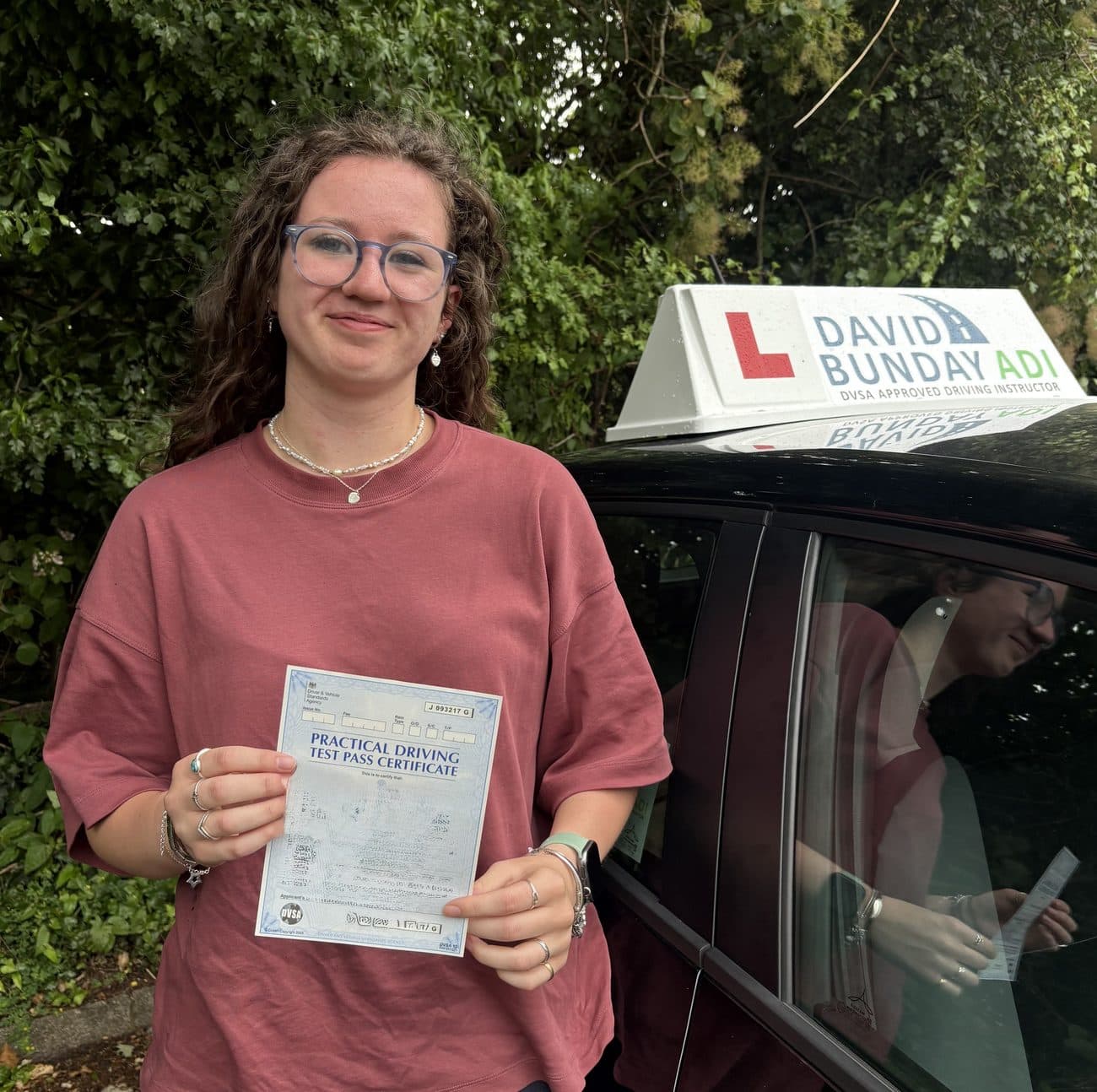Pupil celebrating passing their driving test with David Bunday ADI